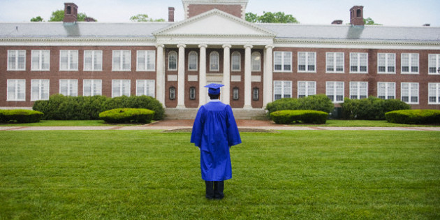 College Graduate Looking At College Building